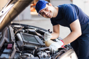 Mechanic Working on Car